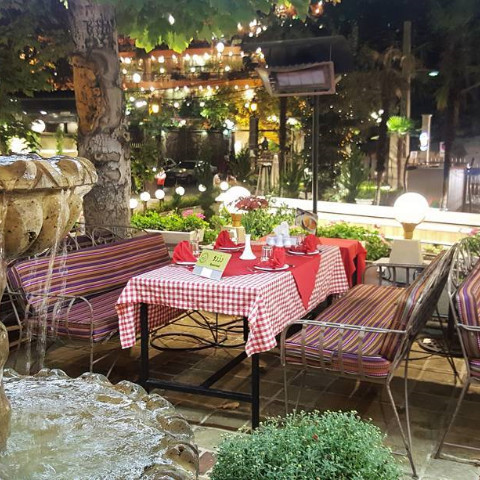 Koohpaye terrace beside a fountain